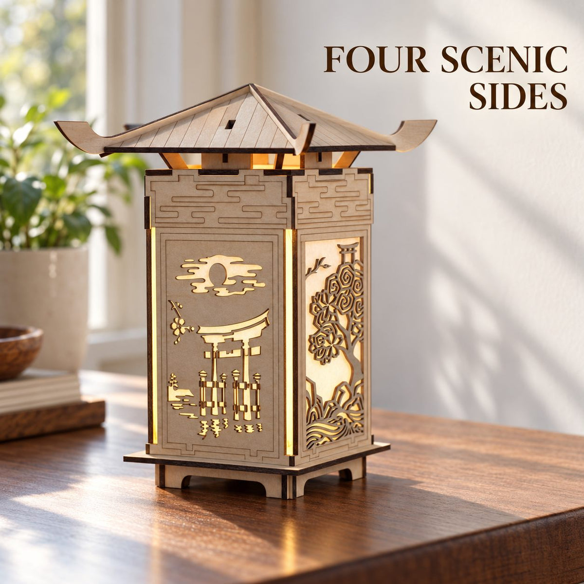 M01 wooden pagoda lantern showing the torii gate over water and adjacent blossom-tree panel on a sunlit tabletop