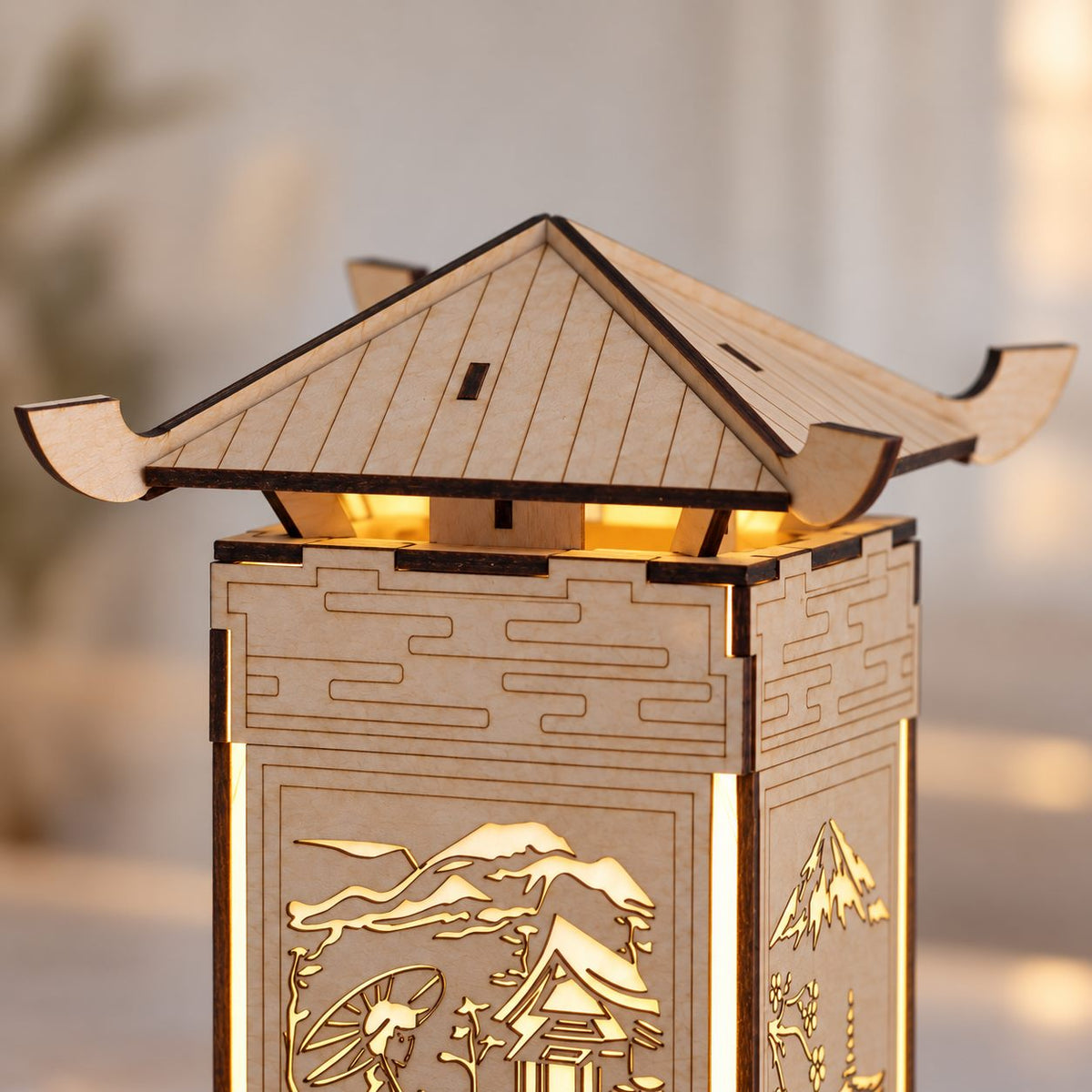 Close-up of the engraved triangular roof panels, curved eaves and wooden supports of the M01 pagoda lantern