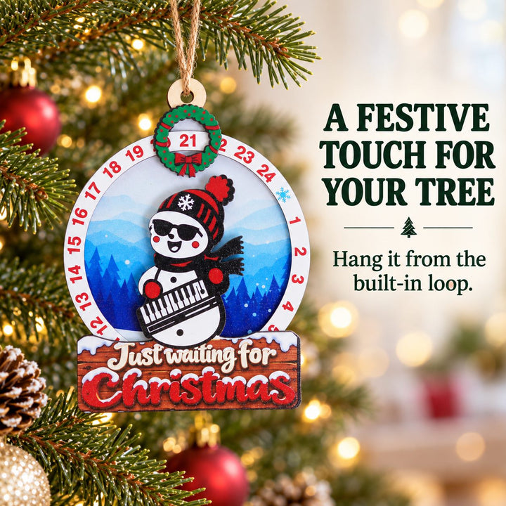 Snowman Keyboard wooden Christmas countdown hung through its built-in wooden hole on a Christmas tree