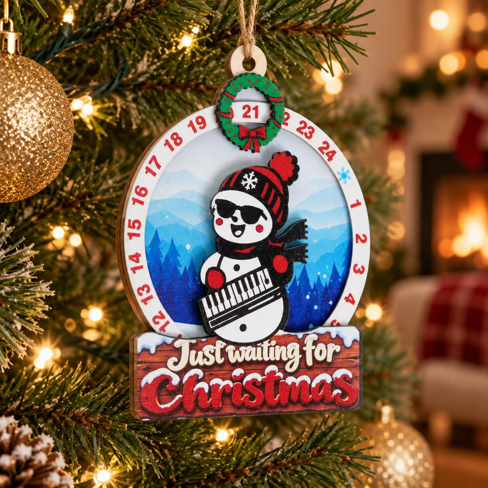 Snowman Keyboard wooden Christmas countdown hanging on the Christmas tree with warm surrounding lights