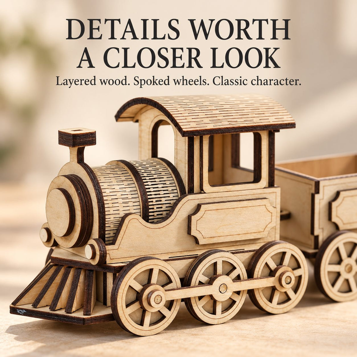 Close-up of the M40 locomotive spoked wheels, straight connecting rod and laser-cut wooden layers