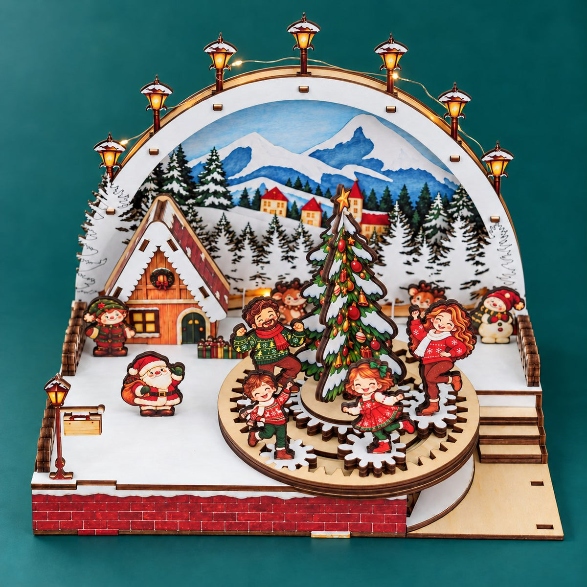 Complete Christmas Family Carousel wooden DIY kit on a pine-teal background, with four upright family figures on the gear ring