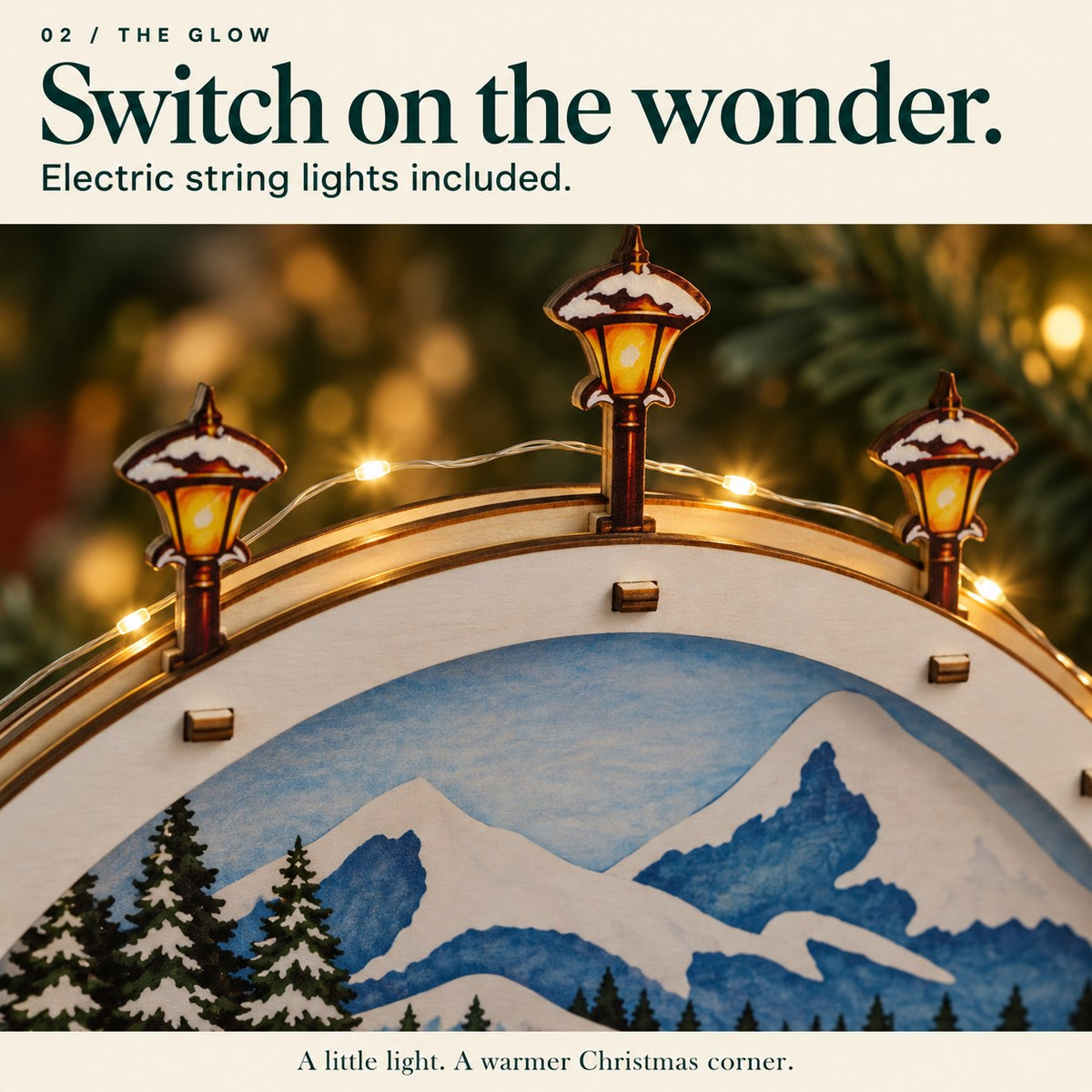 Close detail of the included electric string-light wire along the snowy wooden arch