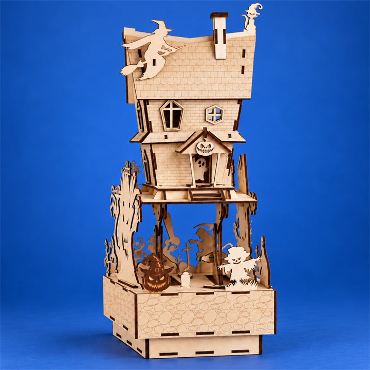 Haunted House Wooden DIY Model Kit on a colorful studio background, full product view