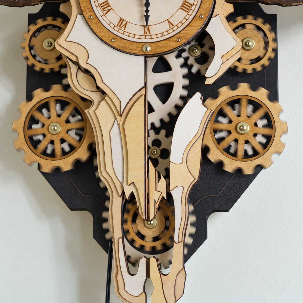 Close-up of the exposed wooden gears beneath the clock face